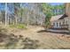 Backyard view with a small patio. Natural landscape offers a serene outdoor experience at 100 Hamilton Glen Ct, Fayetteville, GA 30215
