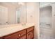 Bathroom with single vanity, large mirror, white countertop and a tub and shower combo at 100 Hamilton Glen Ct, Fayetteville, GA 30215