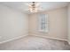 Neutral bedroom with new carpet, ceiling fan with light fixture, and one window at 100 Hamilton Glen Ct, Fayetteville, GA 30215