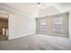Tranquil bedroom with vaulted ceiling, carpet, and plenty of natural light at 100 Hamilton Glen Ct, Fayetteville, GA 30215