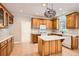 Traditional eat-in kitchen with an island and stainless steel appliances and abundant counter space at 100 Hamilton Glen Ct, Fayetteville, GA 30215