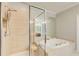 Modern bathroom featuring a walk-in shower, a jacuzzi tub, and tile flooring at 1111 Newpark View Pl, Mableton, GA 30126