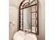 Elegant powder room featuring an ornate framed mirror and pedestal sink at 1111 Newpark View Pl, Mableton, GA 30126
