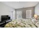 Cozy bedroom featuring a large bed, flat screen TV, and plenty of natural light at 1111 Newpark View Pl, Mableton, GA 30126