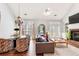 Open-concept living room with high ceilings, fireplace, and backyard access at 1111 Newpark View Pl, Mableton, GA 30126