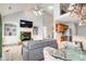 Open-concept living room with high ceilings, a fireplace, built-in shelving, and a staircase to an upper level at 1111 Newpark View Pl, Mableton, GA 30126