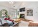 Comfortable living room with fireplace and backyard access at 1111 Newpark View Pl, Mableton, GA 30126