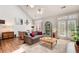 Bright and airy living room with hardwood floors and backyard access at 1111 Newpark View Pl, Mableton, GA 30126