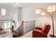 Comfortable loft space with vaulted ceilings, railing, and a view of the living room below at 1111 Newpark View Pl, Mableton, GA 30126