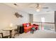 Upper level loft area with vaulted ceilings, railing, furniture, and ample natural light at 1111 Newpark View Pl, Mableton, GA 30126