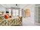 Spacious main bedroom with large windows and a ceiling fan at 1111 Newpark View Pl, Mableton, GA 30126