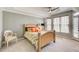 Main bedroom with a seating area, neutral walls, and a ceiling fan at 1111 Newpark View Pl, Mableton, GA 30126