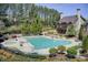 Community pool area with outdoor seating and well-maintained landscaping at 1111 Newpark View Pl, Mableton, GA 30126