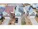 Aerial view of houses with well-manicured lawns and mature trees at 11169 James Madison Dr, Hampton, GA 30228