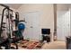 Home gym featuring workout equipment and a television for entertainment during exercise at 11169 James Madison Dr, Hampton, GA 30228