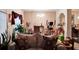 Living room featuring a sofa with pillows, plants, and a chandelier at 11169 James Madison Dr, Hampton, GA 30228