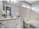 Clean bathroom with a white vanity, tub, and soft natural lighting at 484 Martin Se St, Atlanta, GA 30312