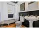 Updated bathroom featuring a classic clawfoot tub and pedestal sink with modern fixtures at 484 Martin Se St, Atlanta, GA 30312