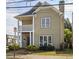 Two-story home featuring a covered porch and white columns, windows, and neutral siding at 484 Martin Se St, Atlanta, GA 30312