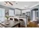 Eat-in kitchen with white cabinets, stainless appliances, and hardwood floors at 484 Martin Se St, Atlanta, GA 30312
