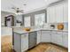 Bright kitchen with white cabinetry, stainless steel appliances, and hardwood floors at 484 Martin Se St, Atlanta, GA 30312