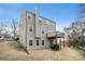 View of the home's backyard with a deck and plenty of room for entertaining, plus exterior wall chimney at 665 Sable View Ln, Atlanta, GA 30349