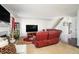 Spacious living room featuring a fireplace and adjacent staircase at 665 Sable View Ln, Atlanta, GA 30349