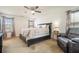 Spacious main bedroom with ceiling fan, plush carpet and natural lighting at 665 Sable View Ln, Atlanta, GA 30349