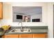 Kitchen features a double sink with a view into the adjacent living area at 665 Sable View Ln, Atlanta, GA 30349