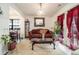 Living area showcasing natural lighting, traditional furnishings, and a view of a dining area at 665 Sable View Ln, Atlanta, GA 30349