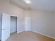 Neutral bedroom with carpet, white trim and door, featuring ample closet space at 6716 Browns Mill Ferry Dr, Lithonia, GA 30038