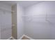 Walk-in closet features built-in wire shelving and durable wood-look flooring at 6716 Browns Mill Ferry Dr, Lithonia, GA 30038