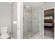 Bathroom featuring marble shower with glass door at 1184 Metropolitan Sw Pkwy, Atlanta, GA 30310