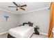Bedroom with gray walls, ceiling fan, natural light from the windows and unique decor elements at 1184 Metropolitan Sw Pkwy, Atlanta, GA 30310