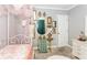 Elegant bedroom featuring a canopy bed, gold accents, and artistic decor at 1184 Metropolitan Sw Pkwy, Atlanta, GA 30310
