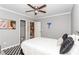 Bedroom with light gray walls, closet, view to bathroom and a black and white checkered rug at 1184 Metropolitan Sw Pkwy, Atlanta, GA 30310