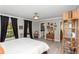 Bedroom featuring natural light, vintage decor, and a bathroom entrance at 1184 Metropolitan Sw Pkwy, Atlanta, GA 30310