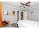 Bedroom with light gray walls, closet, view to bathroom and a black and white checkered rug at 1184 Metropolitan Sw Pkwy, Atlanta, GA 30310
