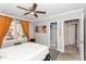 Bedroom with light gray walls, closet, view to bathroom and a black and white checkered rug at 1184 Metropolitan Sw Pkwy, Atlanta, GA 30310