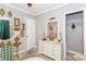 Charming bedroom with a dresser, gold decor, and a view to the closet at 1184 Metropolitan Sw Pkwy, Atlanta, GA 30310