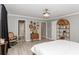 Spacious bedroom featuring unique decor, hardwood floors and a ceiling fan at 1184 Metropolitan Sw Pkwy, Atlanta, GA 30310