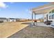 Patio area with chairs and a grill, overlooking the yard and the surrounding neighborhood at 2030 Vidalia Court, Dacula, GA 30019