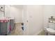 Modern bathroom showcasing a stylish vanity, toilet, and tiled flooring, offering a clean and comfortable space at 2030 Vidalia Court, Dacula, GA 30019