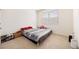 A simple bedroom with neutral carpet, a bright window, and a cozy bed at 2030 Vidalia Court, Dacula, GA 30019