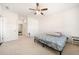 Comfortable bedroom with neutral carpet, ceiling fan, and bright white walls at 2030 Vidalia Court, Dacula, GA 30019
