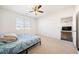 Bedroom featuring neutral carpet and a large window, creating a comfortable and inviting atmosphere at 2030 Vidalia Court, Dacula, GA 30019