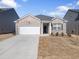 Charming single-story home features a two-car garage and classic brick facade at 2030 Vidalia Court, Dacula, GA 30019