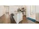 Bright kitchen with an island, granite countertops and stainless steel appliances at 2030 Vidalia Court, Dacula, GA 30019