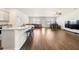 Open concept living area with wood floors, a kitchen island and plenty of natural light at 2030 Vidalia Court, Dacula, GA 30019
