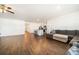 Bright and open living room with a modern kitchen island and stylish gray sectional couch at 2030 Vidalia Court, Dacula, GA 30019